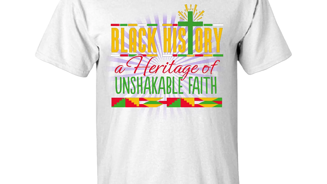 White T-shirt printed Black History, a Heritage of Unshakable Faith, in gold, red and green with a cross and kente-style borders.